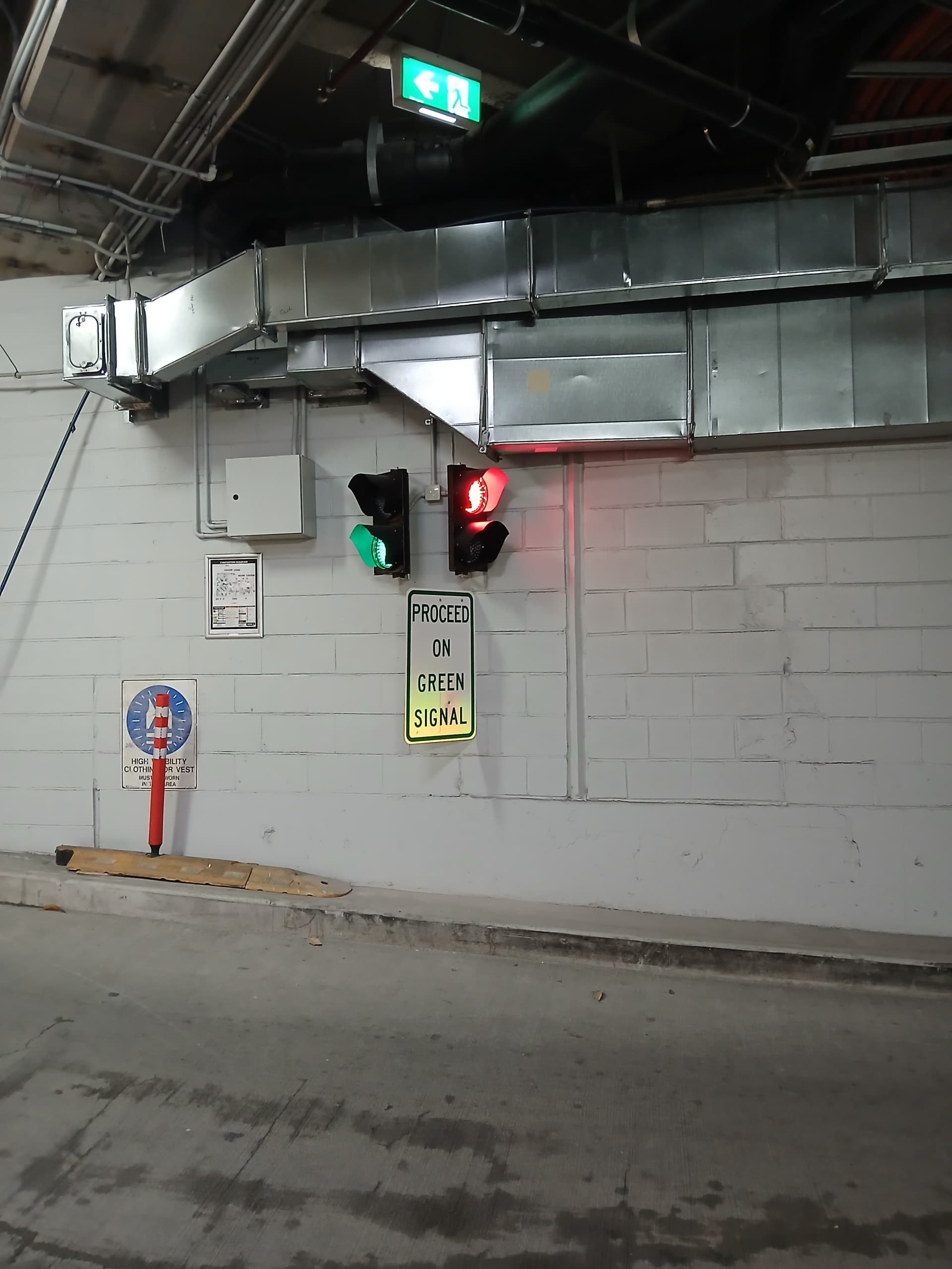 Green traffic signal controlling movement through an underground car-park lane