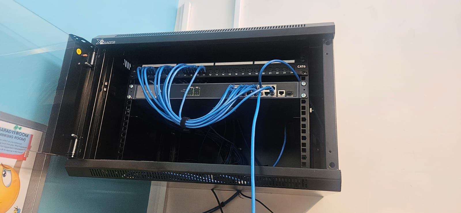 Network rack and data cabling supporting an installed access-control system