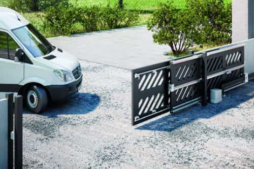 A matt black telescopic sliding gate at a residential home.