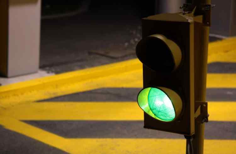 Traffic lights at the entry to a car park.