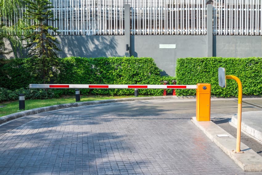 Image of a boom gate at the entrance of a factory.