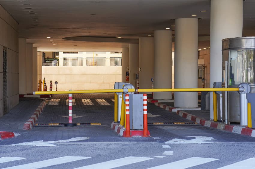 Image of two boom gates at the entrance of a car park.