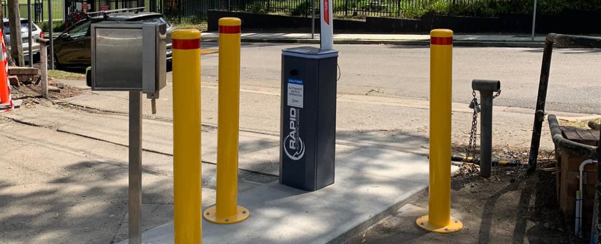 High-traffic volume boom gate with a token and payment system for a hotel car park.