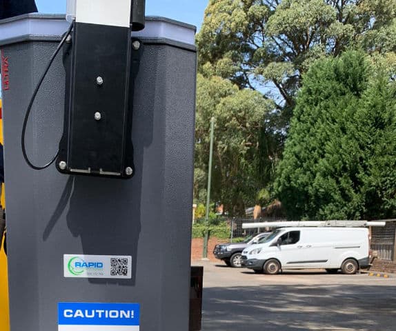 Close-up of an automatic boom gate arm.