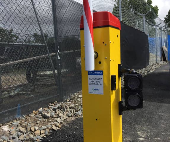 Close-up of high-security airport car park boom gate arm.