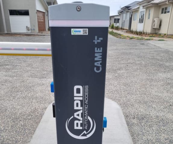 Close-up of a boom gate arm and ultrasonic sensors.