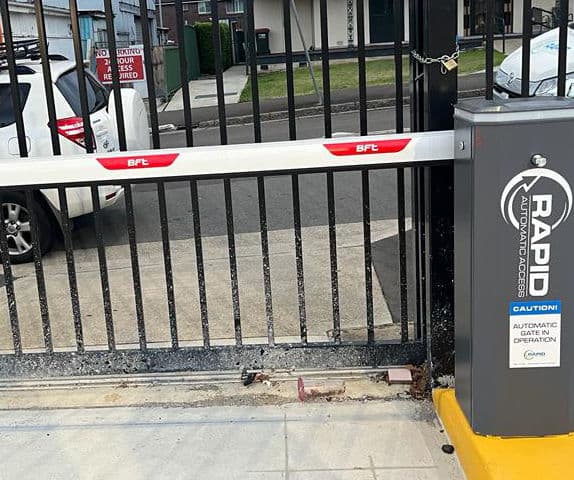 Close-up of a boom gate arm from inside a car park.