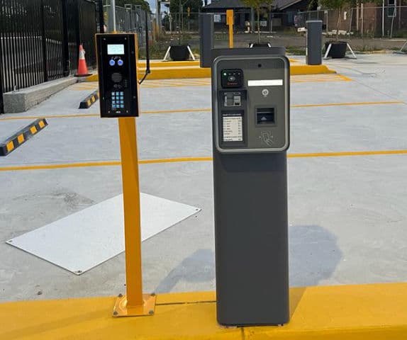 Close-up of a boom gate cashless-payment-on-exit system.