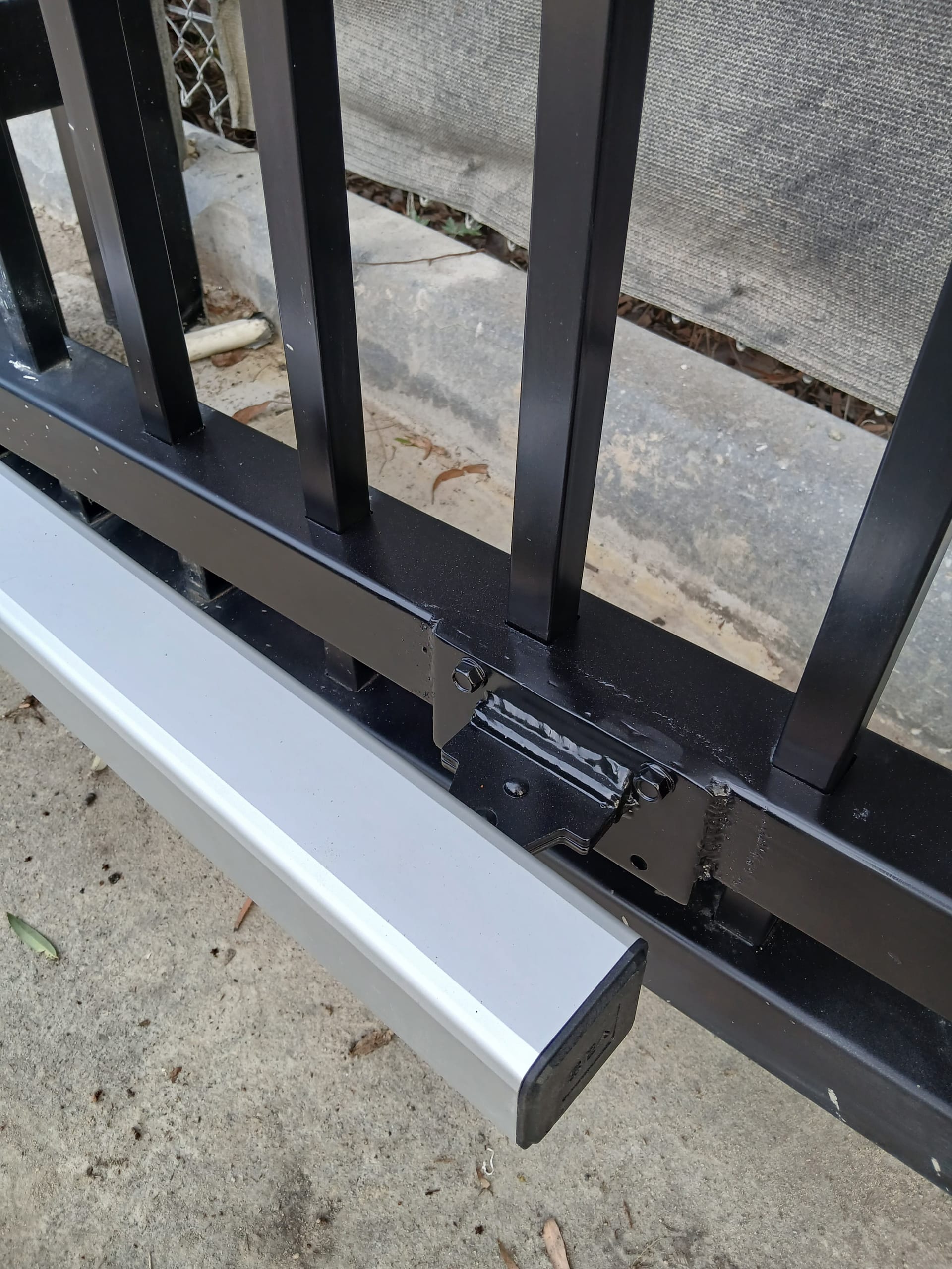 Close-up of an automatic gate mechanism checked during repair.