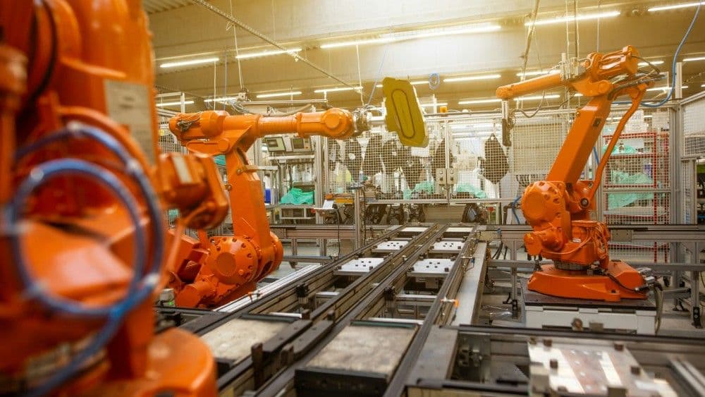 Robotic manufacturing cells inside an automotive plant