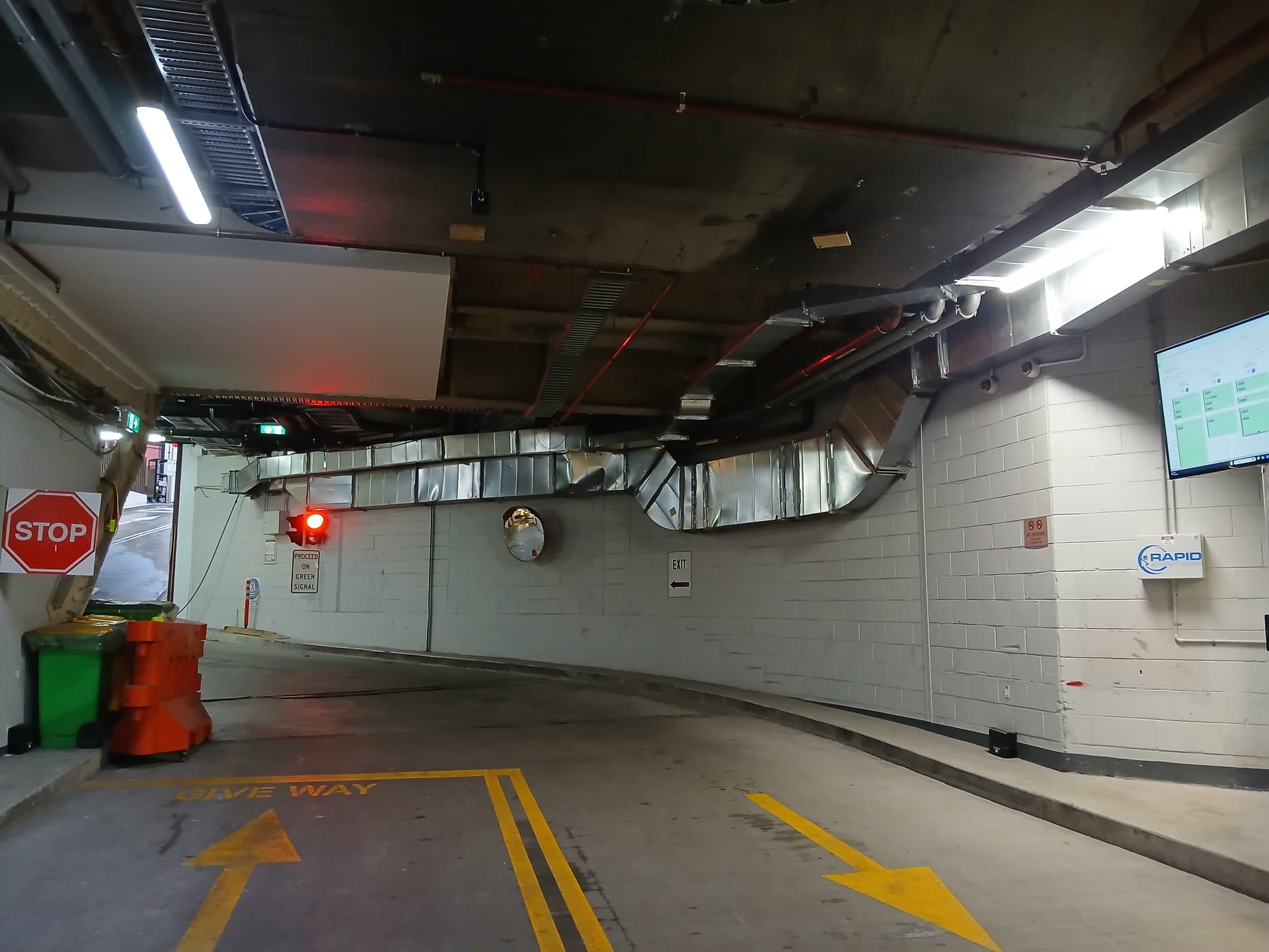 Underground car park access control with stop sign and traffic signal.