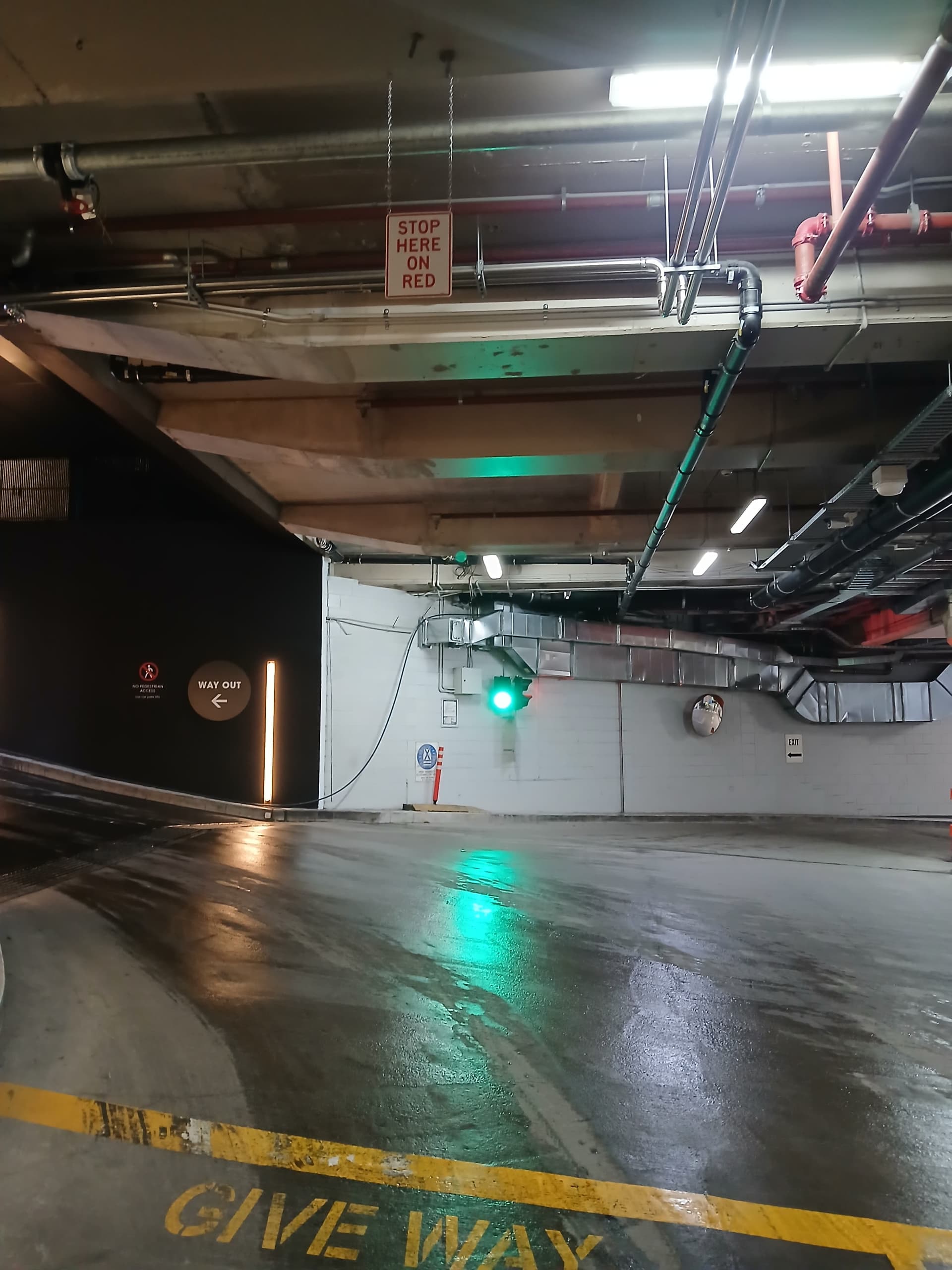 Green traffic light in an underground car park.
