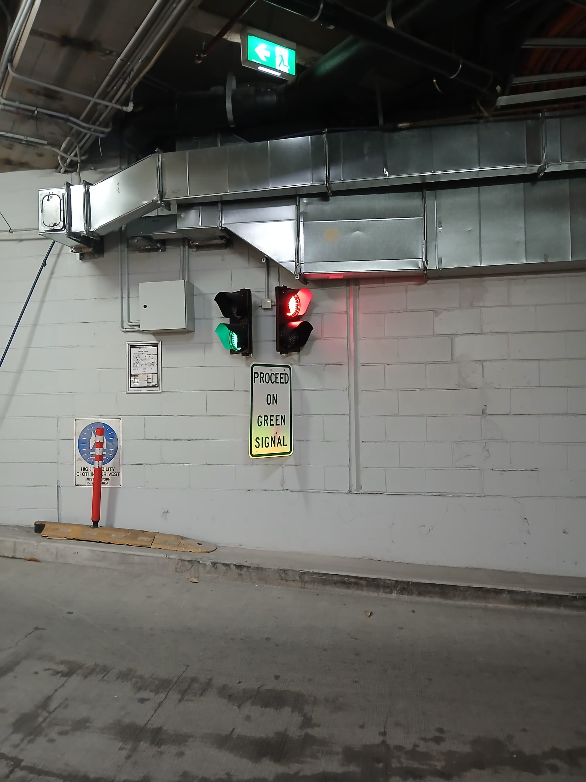 Proceed on green signal in an underground car park.