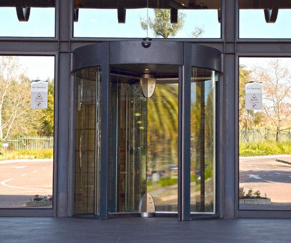 An automatic door at the front of a commercial building.