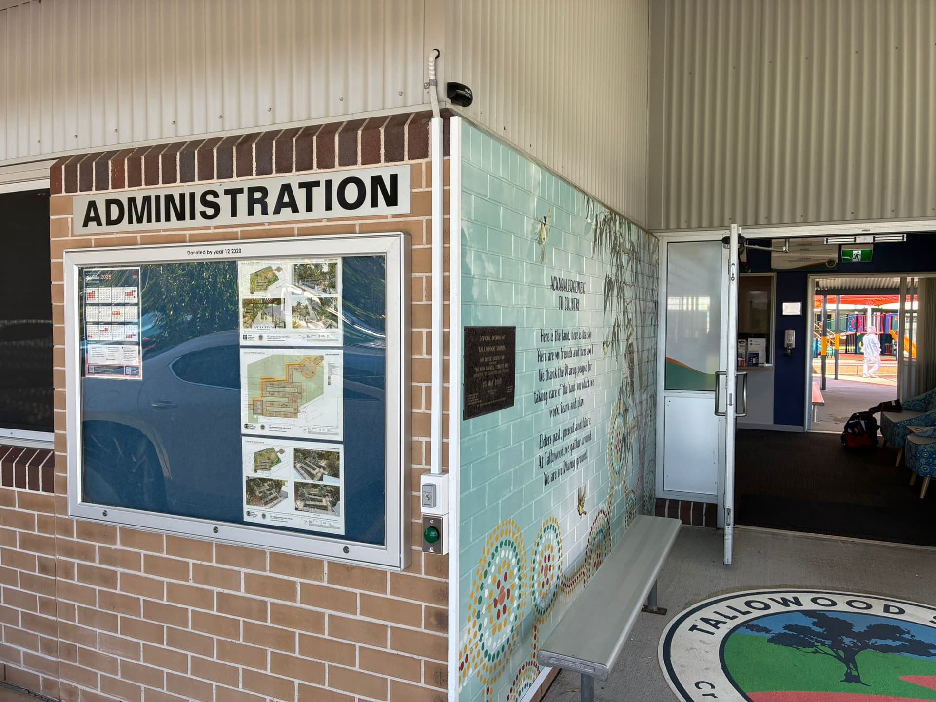 Automatic sliding glass entrance at Tallowood School administration.