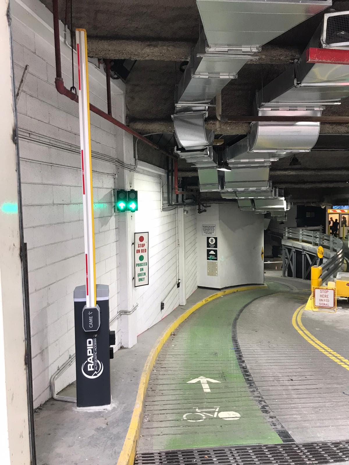 Boom gate controlling an underground car park entry.