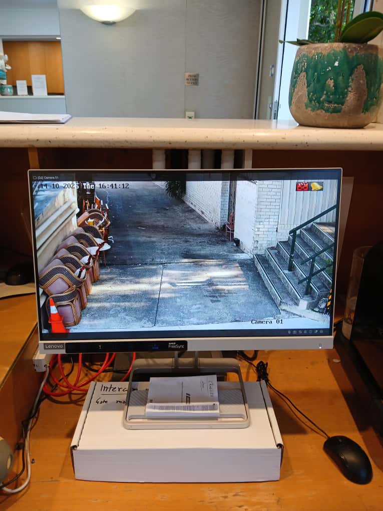Security monitor showing CCTV footage for access control review.