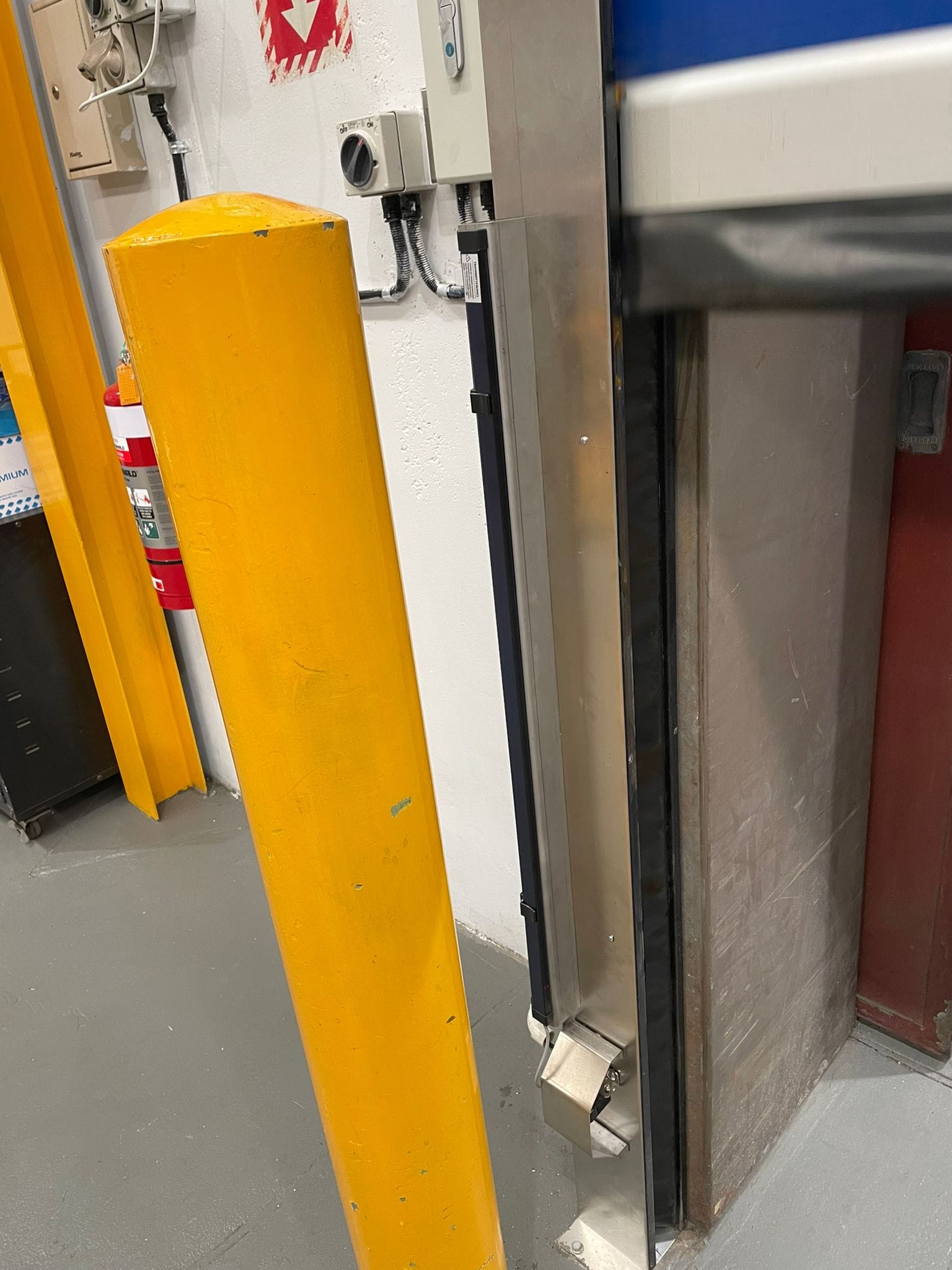 High-speed door control panel with emergency stop button.