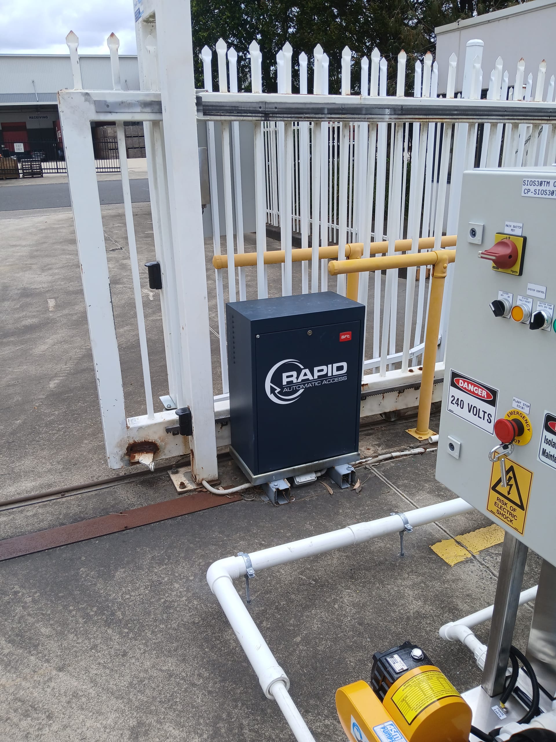 Automatic sliding gate operator and control panel inspected for gate repairs.