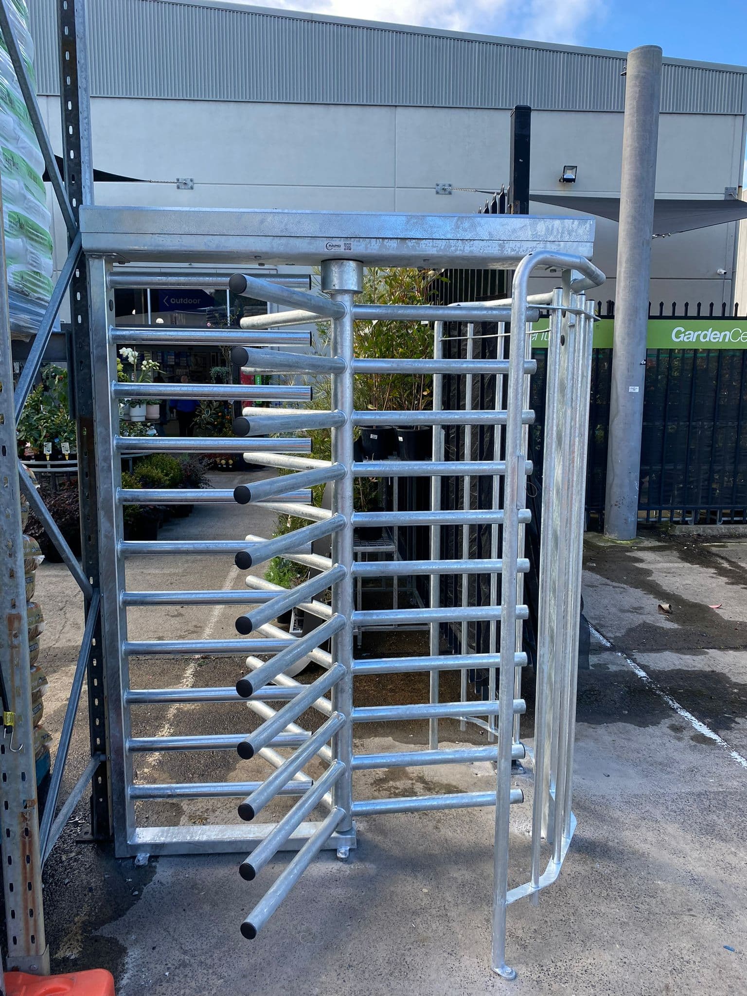 Galvanized full-height turnstile installed at a facility entrance