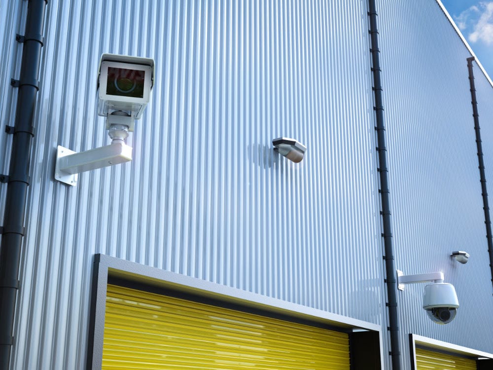 External CCTV cameras installed on a commercial building.