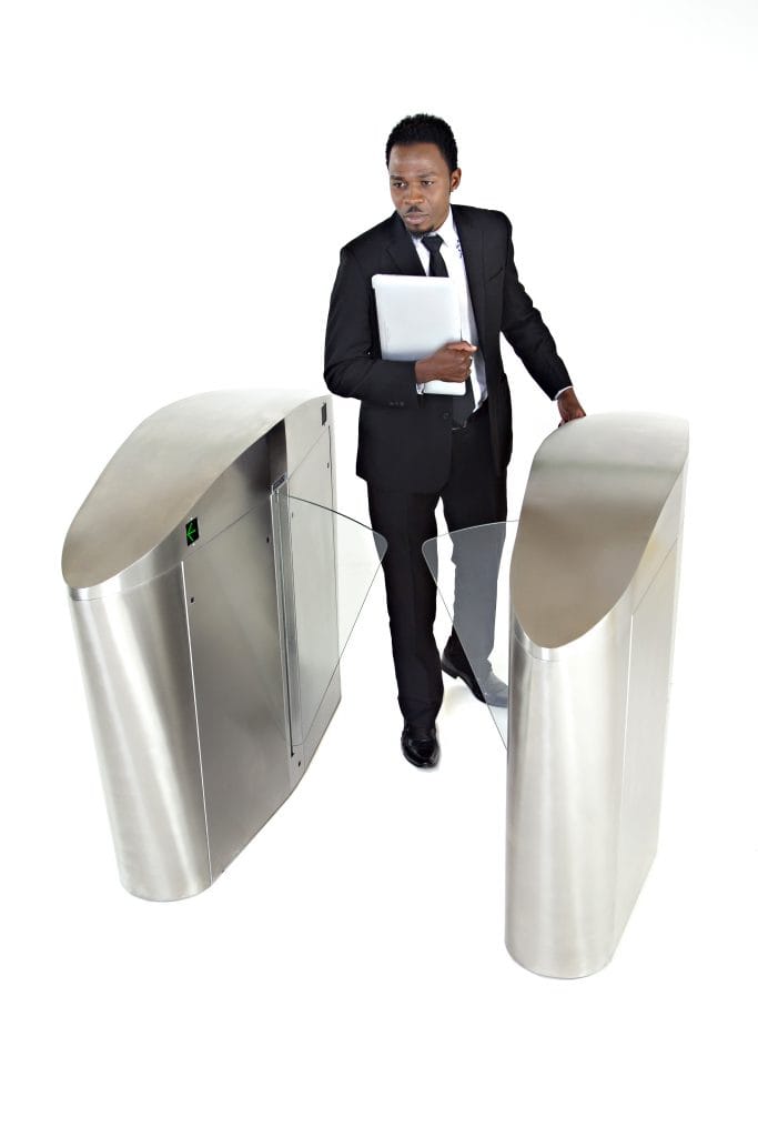 Retractable speed gate installation with stainless steel body.